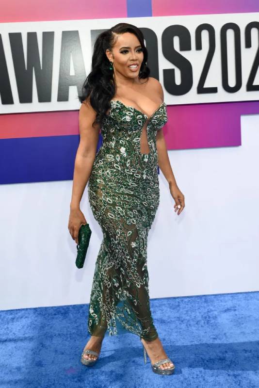 Angela Simmons with Gun-shaped Purse