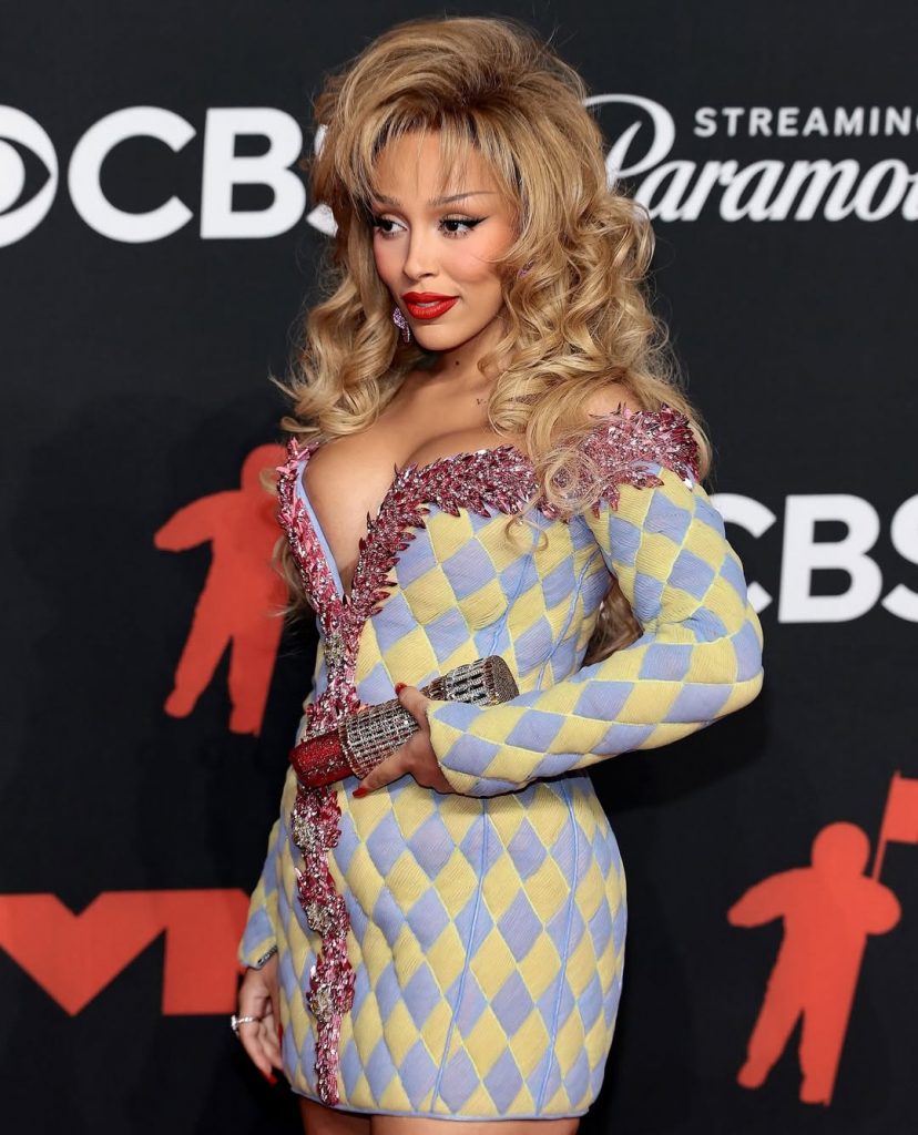 Doja Cat with a Lipstick Clutch