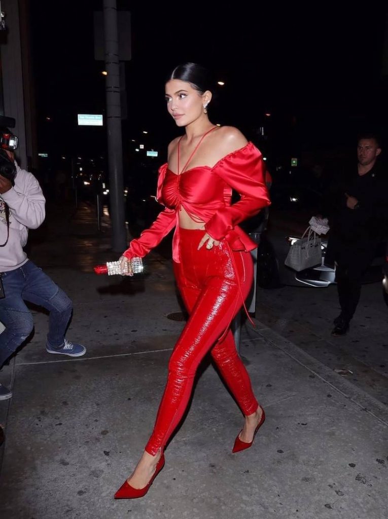 kylie jenner with lipstick-shaped clutch