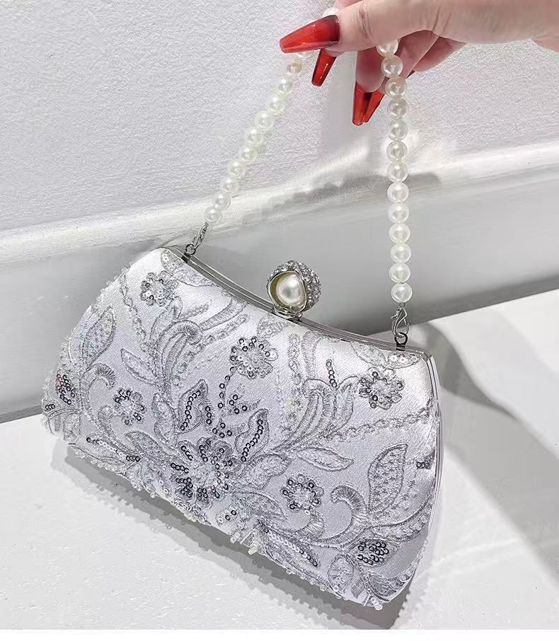 embroidery clutch with pearl handle